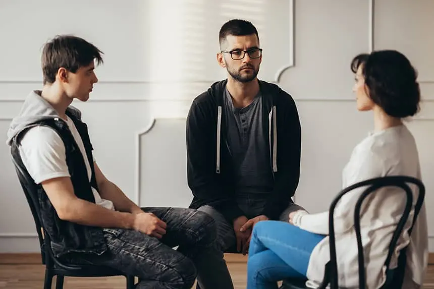 a group of people sitting in chairs at group therapy in san francisco